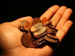 Photo of coins in palm of hand